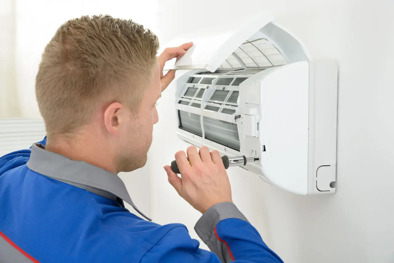 Ideal Air technician repairing split system